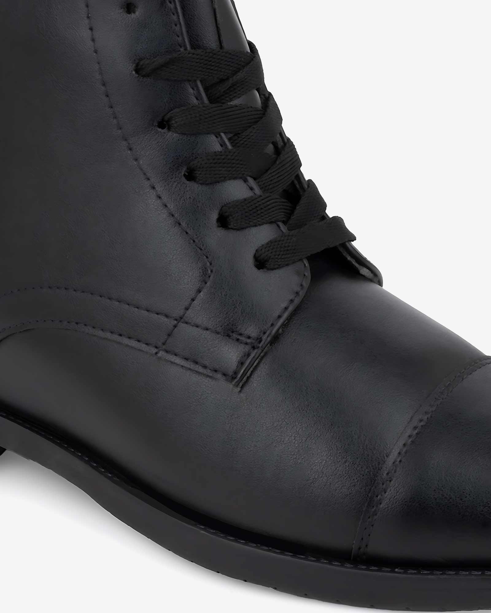 Close-up front view of Hitoes Darsel  black elevator formal boots with built-in height lift