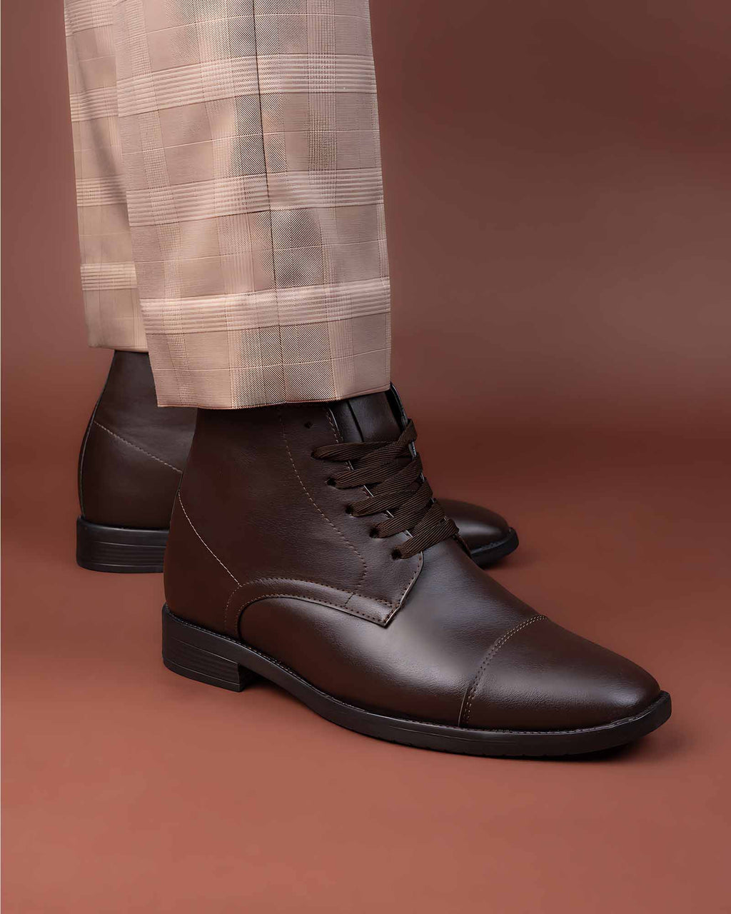 Lifestyle model wearing Hitoes Darsel brown height increasing formal boots with 3 inches hidden lift