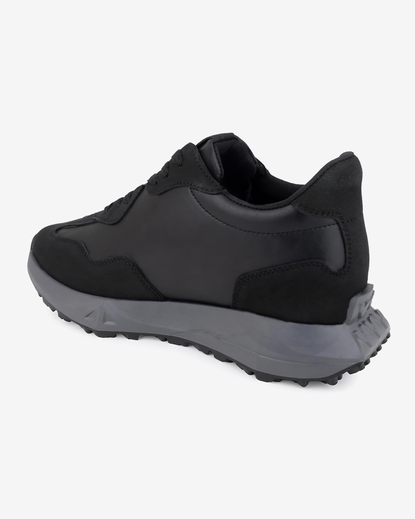 Back angled view of Hitoes Orren black sneakers with hidden height boost
