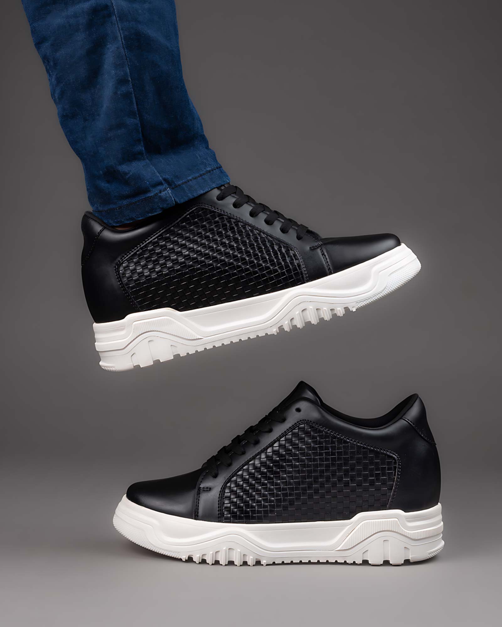 Lifestyle model wearing Hitoes Zyft Matrix black height increasing sneakers with hidden lift